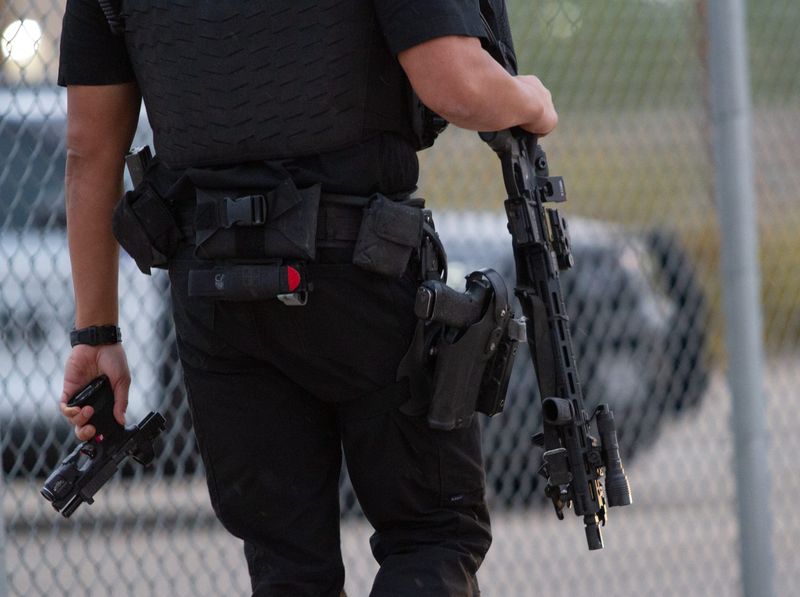 El Paso County law enforcement officials demonstrate the gun buyback program in 2023. The county's final gun buyback will take place at the county tax office at Ascarate Park on Saturday, Aug. 16, 2025.