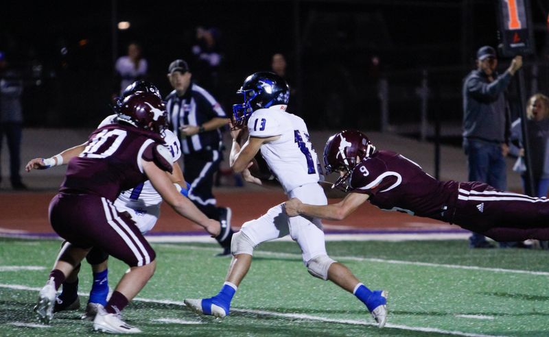 Richland Springs' (13) Cohen Ethridge tries to break a diving tackle attempt from Bronte's Caleb McIntire (9) at O.K. Wolfenbarger Field on Nov. 17, 2023.