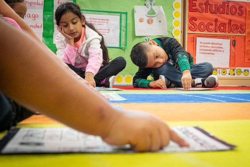 In this 2023 file photo, Tuloso-Midway Primary School kindergarten students Cataleya Sanchez and Santiago Rodriguez practice the Spanish alphabet during class.