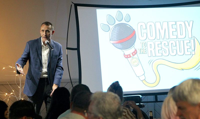 Comedian Clay Foley makes some introductory remarks to the crowd before introducing fellow comedian Jamie Utley at Comedy to the Rescue on Saturday Aug. 3, 2024. A silent auction was also part of the fundraising event for the White River Humane Society.
