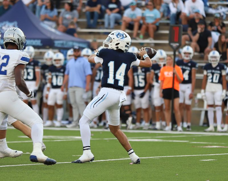 West Plains quarterback Reid Macon (14) looks downfield for an open receiver during a non-district game against Estacado on Friday, Sept. 13, 2024 at Happy State Bank Stadium in Canyon, Texas.