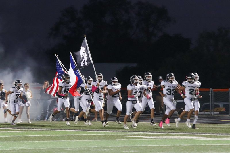 The Water Valley football team runs on the field at Griffith Stadium on Friday, Oct. 25, 2024.