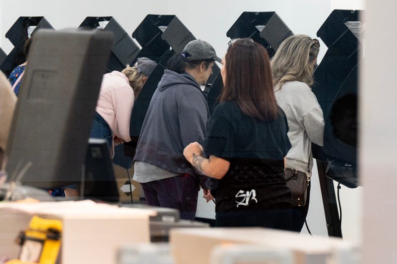 Early voters cast their ballot at the Basset Place Mall ahead of the general election in El Paso, Texas on Nov. 1, 2024.