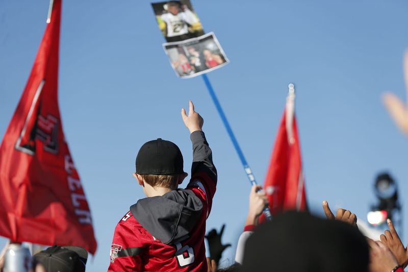 A Texas Tech fan holds their Guns Up at the FOX Big Noon Kickoff football pregame show at Texas Tech University, Saturday, Nov. 9, 2024 at Jones AT&T Stadium.
