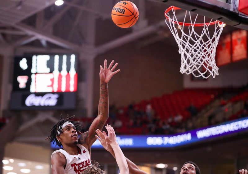 Texas Tech's JT Toppin shoots over the Wyoming defense during a non-conference basketball game, Wednesday, Nov. 13, 2024, in United Supermarkets Arena.