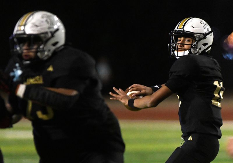 Lamesa’s Daniel Ramos prepares to throw the ball against Amarillo River Road in a Class 3A Division I bi-district football game, Thursday, Nov. 14, 2024, at Peoples Bank Stadium in Wolfforth.