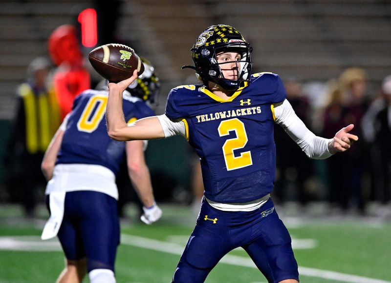 Stephenville quarterback Ryan Gafford attempts a pass as Hereford defenders close in during Thursday’s Class 4A Div. I playoff game at Shotwell Stadium in Abilene Nov. 21, 2024. Final score was 35-7, Stephenville.