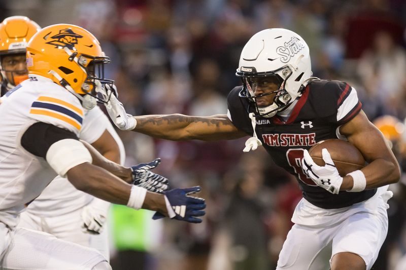 NMSU’s PJ Johnson III (0) runs the ball during the Battle of I-10 rivalry football game against UTEP at Aggie Memorial Stadium in Las Cruces, NM, on Saturday, Nov. 30, 2024.