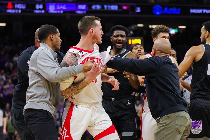 Jan 13, 2023; Sacramento, California, USA; Houston Rockets guard Garrison Mathews (25) and Sacramento Kings forward Chimezie Metu (7) confront each other during the fourth quarter at Golden 1 Center. Mandatory Credit: Sergio Estrada-USA TODAY Sports