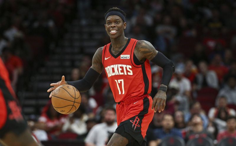 Mar 20, 2022; Houston, Texas, USA; Houston Rockets guard Dennis Schroder (17) brings the ball up the court during the third quarter against the Memphis Grizzlies at Toyota Center. Mandatory Credit: Troy Taormina-USA TODAY Sports