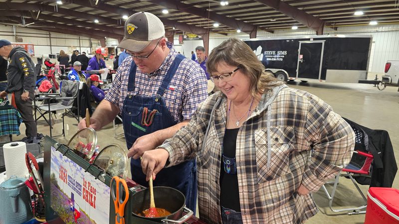 In this January 2025 file photo, Tri-State Champ Patty Brittan and her husband Harry work on their top tier chilli at the annual Tri-State Open Chili Championship's chili cook-off in Amarillo.