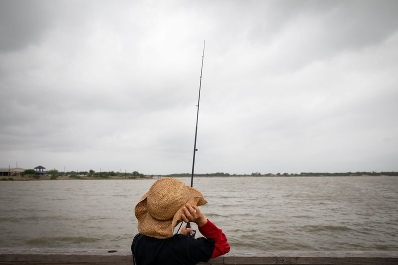 James Koch, 10, of Wharton, fishes off a pier in Baffin Bay during the Exploring Baffin Bay summer camp hosted by Texas Brigades and Bringing Baffin Back on May 4, 2024, in Riviera, Texas.