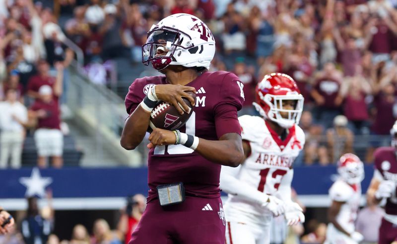 Sep 28, 2024; Arlington, Texas, USA; Texas A&M Aggies quarterback Marcel Reed (10) reacts after scoring a touchdown during the first half against the Arkansas Razorbacks at AT&T Stadium. Mandatory Credit: Kevin Jairaj-Imagn Images