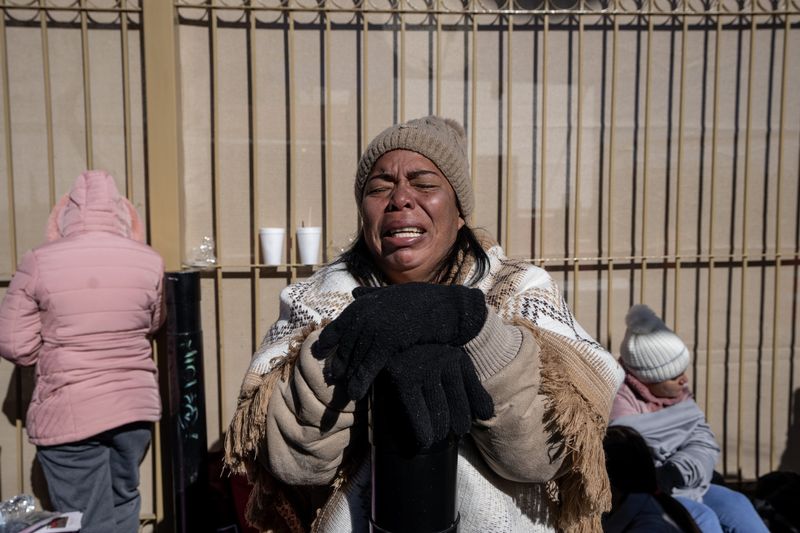 Margelis Tinoco, 48, of Colombia, cries Jan. 20, 2025, after finding out her 1 p.m. appointment was no longer valid via the CBP One app.