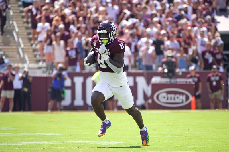 Sep 7, 2024; College Station, Texas, USA; Texas A&M Aggies running back Le'Veon Moss (8) runs the ball during the first quarter against the McNeese State Cowboys at Kyle Field. Mandatory Credit: Dustin Safranek-Imagn Images