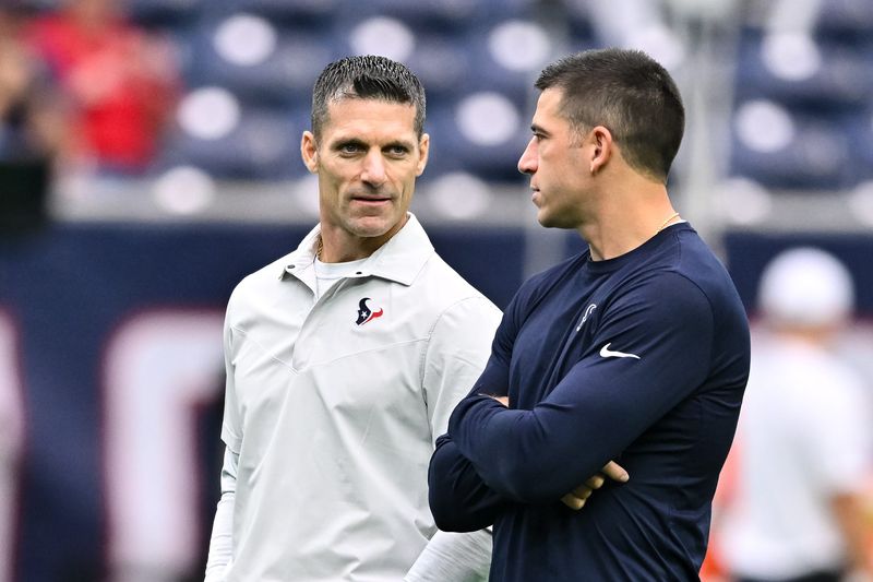 Sep 17, 2023; Houston, Texas, USA; Houston Texans general manager Nick Caserio (left) speaks with special teams coordinator Frank Ross (right) prior to the game against the Indianapolis Colts at NRG Stadium. Mandatory Credit: Maria Lysaker-USA TODAY Sports