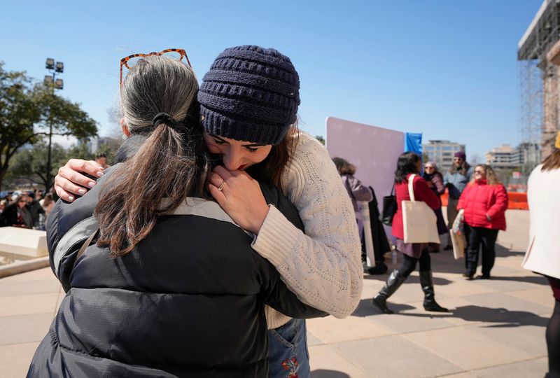 Summer Willis, right, a survivor of sexual assault, hugs Paulina Pizarro at a rally in support of domestic and sexual assault survivors at the Capitol Thursday February 20, 2025. Survivors of violence and advocates with The Texas Council on Family Violence and The Texas Association Against Sexual Assault rallied to push for policy and funding items during the 89th Legislative Session.