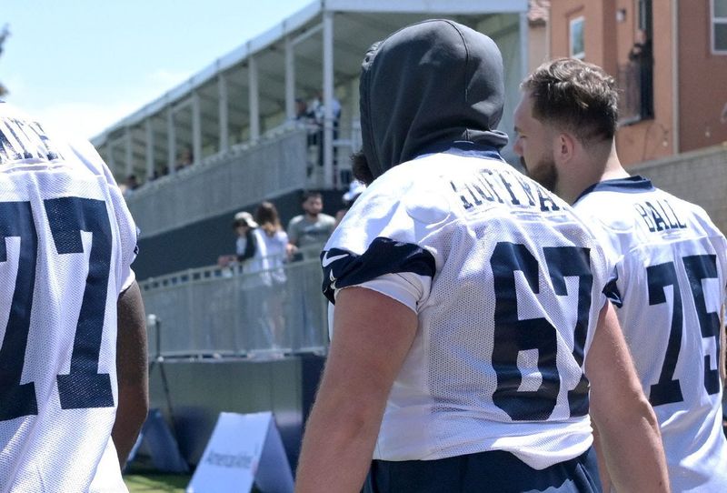 Jul 26, 2023; Oxnard, CA, USA; Dallas Cowboys offensive tackle Tyron Smith (77), center Brock Hoffman (67) and offensive tackle Josh Ball (75) walk onto the field for the first day of training camp drills at River Ridge Playing Fields in Oxnard, CA. Mandatory Credit: Jayne Kamin-Oncea-USA TODAY Sports