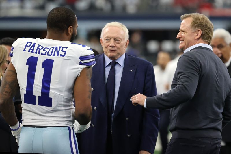 Jan 16, 2022; Arlington, Texas, USA; Dallas Cowboys outside linebacker Micah Parsons (11) meets with owner Jerry Jones (center) and NFL commissioner Roger Goodell (right) prior to the NFC Wild Card playoff football game against the San Francisco 49ers at AT&T Stadium. Mandatory Credit: Kevin Jairaj-USA TODAY Sports