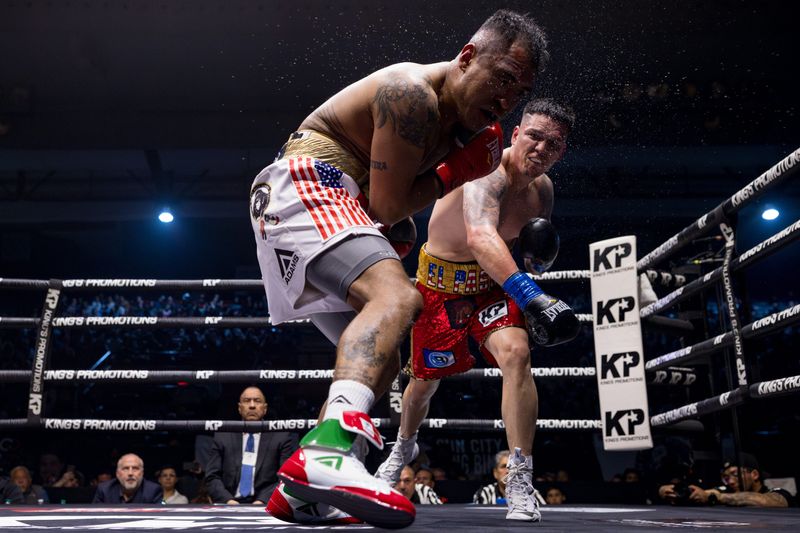 El Paso boxer Jorge Tovar, right, won by TKO at 1:15 of the fifth round against Mexican boxer Juan Francisco Lopez Barajas in the middleweight division of King’s Promotions Ring Wars XV boxing match on Saturday, Feb. 22, 2025, at the El Paso County Coliseum.