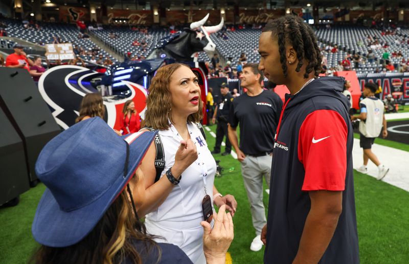 Aug 24, 2024; Houston, Texas, USA; Houston Texans quarterback C.J. Stroud (7) talks to fans before the Texans play against the Los Angeles Rams at NRG Stadium. Mandatory Credit: Thomas Shea-USA TODAY Sports