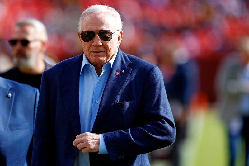 Nov 24, 2024; Landover, Maryland, USA; Dallas Cowboys owner Jerry Jones walks off the field before the game between the Washington Commanders and the Dallas Cowboys at Northwest Stadium. Mandatory Credit: Peter Casey-Imagn Images