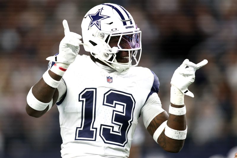 Dec 9, 2024; Arlington, Texas, USA; Dallas Cowboys linebacker DeMarvion Overshown (13) reacts after making a tackle against the Cincinnati Bengals in the first quarter at AT&T Stadium. Mandatory Credit: Tim Heitman-Imagn Images