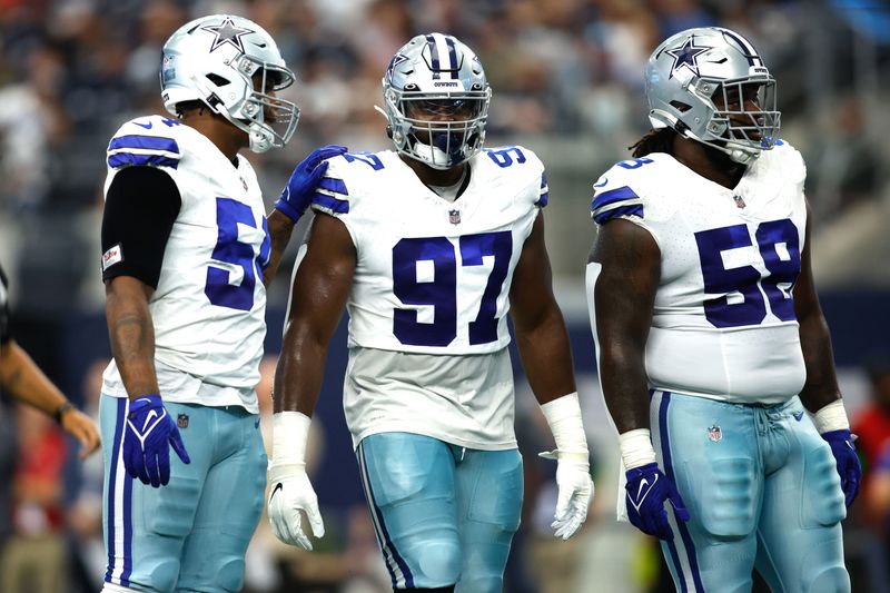 Aug 12, 2023; Arlington, Texas, USA;Dallas Cowboys defensive tackle Osa Odighizuwa (97) and defensive tackle Mazi Smith (58) on the field in the game against the Jacksonville Jaguars at AT&T Stadium. Mandatory Credit: Tim Heitman-USA TODAY Sports
