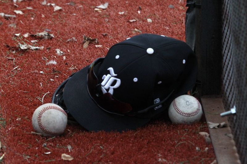 Mar 6, 2025; Amarillo, Texas, USA; A general view of a Randall Raiders hat and baseballs during the game between the Randall Raiders and the Caprock Longhorns at Caprock High School Longhorn Field. Michael C. Johnson/ for Globe-News