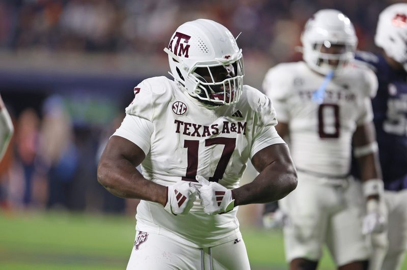Nov 23, 2024; Auburn, Alabama, USA; Texas A&M Aggies defensive lineman Albert Regis (17) reacts after making a tackle against the Auburn Tigers in the third quarter at Jordan-Hare Stadium. Mandatory Credit: John Reed-Imagn Images
