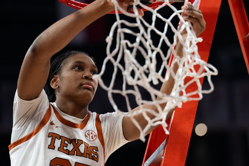Texas Longhorns forward Madison Booker (35) cuts down a piece of net to celebrate the Longhorns' SEC victory following their win over the Florida Gators, March 2, 2025. With the 72-46 win over the Gators, the Texas Longhorns become regular season SEC Champions.