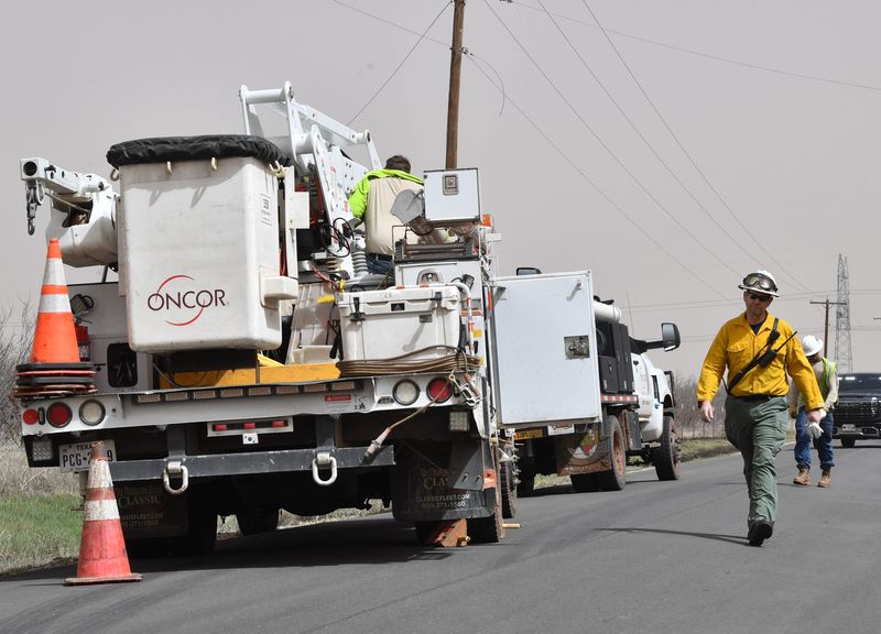 Oncor Electric arrives to the scene of downed power lines near Old State Road and Quail Ridge Road on March 14.