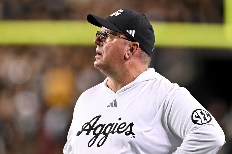 Oct 26, 2024; College Station, Texas, USA; Texas A&M Aggies head coach Mike Elko watches the replay in the third quarter against the LSU Tigers at Kyle Field. Mandatory Credit: Maria Lysaker-Imagn Images.