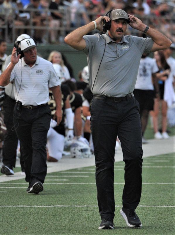 Rider's defensive coordinator Ross Dillard looks at the scoreboard during the matchup against Midlothian on Friday, September 10, 2021 at Memorial Stadium.