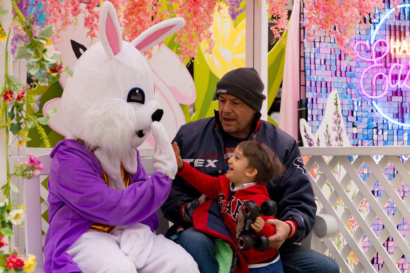 Kids high-five the Easter Bunny at the Shoppes at Solana in West El Paso on Saturday, April 5, 2025.