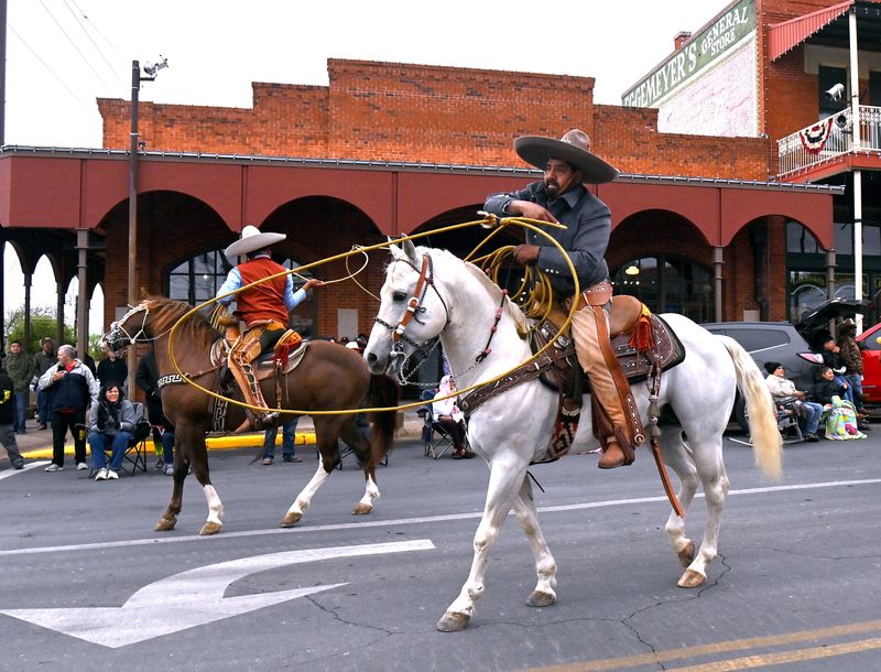 Riders perform rope tricks for the crowd during Saturday’s San Angelo Rodeo Parade April 5, 2025. There were over 100 entries in this year’s parade.