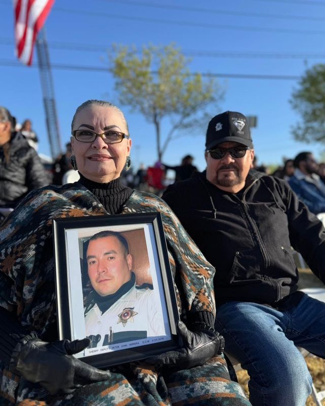 Esther Herrera, the mother of fallen El Paso County Sheriff's Office Deputy Peter Herrera who was fatally shot during a traffic stop in 2019, holds a photo of her son during the annual El Paso District Attorney's Office's Crime Victims Reading of the Names ceremony Sunday, April 6, 2025, at Yucca Park in El Paso's Lower Valley.