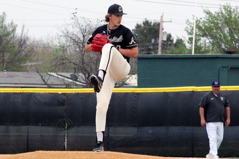 Abilene High's George Ferguson winds up to deliver a pitch during the Eagles' District 4-5A crosstown rivalry baseball game against the Abilene Wylie Bulldogs on Tuesday, April 1, at Abilene High School. The Eagles won 6-0.