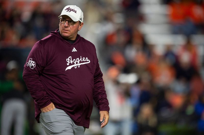 Texas A&M Aggies head coach Mike Elko during warm ups before Auburn Tigers take on Texas A&M Aggies at Jordan-Hare Stadium in Auburn, Ala., on Saturday, Nov. 23, 2024.