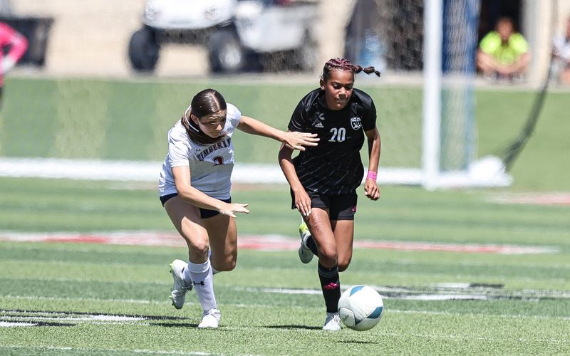 Randall freshman Lyla Williams (20) looks to get past a Wimberley defender during a Class 4A Division II state title match Thursday, April 10, 2025 at Birkelbach Field in Georgetown, Texas.