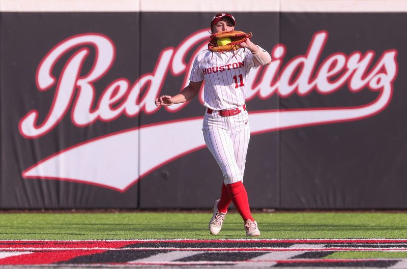 Houston's Jordee Wilkins catches a fly ball against Texas Tech during a Big 12 Conference softball game, Friday, April 11, 2025, at Rocky Johnson Field.