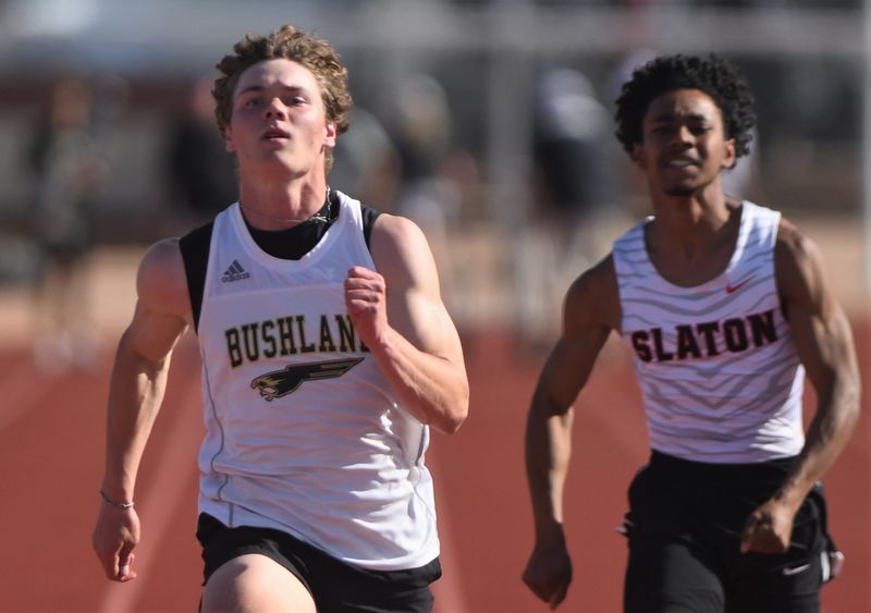 Bushland's Slade Perry, left, competes in the x at the Districts 1/2-3A area track and field meet Thursday, April 10, 2025, at Antelope Stadium in Abernathy.