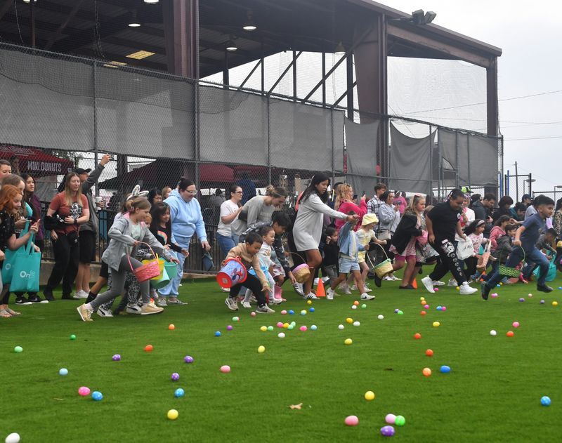 Families race for eggs during an Easter-egg hunt at the Color Me Egg-Cited Easter Market on Saturday, April 19, 2025, at the Wichita Falls Farmers Market.