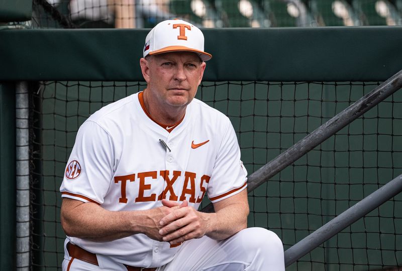 Texas Baseball coach Jim Schlossnagle watches from the dugout as the Longhorns prepare to take on the Auburn Tigers in the first game of a three-game series on Thursday night at UFCU Disch-Falk Field in Austin, April 17, 2025.