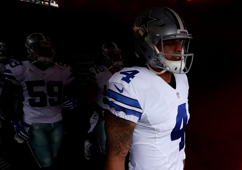 Sep 18, 2016; Landover, MD, USA; Dallas Cowboys quarterback Dak Prescott (4) runs out of the tunnel onto the field prior to the Cowboys' game against the Washington Redskins at FedEx Field. The Cowboys won 27-23. Mandatory Credit: Geoff Burke-USA TODAY Sports