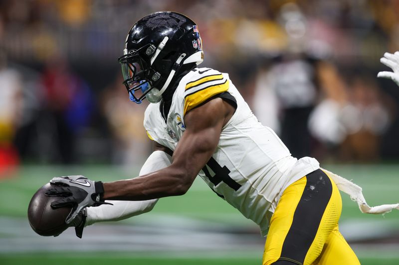 Sep 8, 2024; Atlanta, Georgia, USA; Pittsburgh Steelers wide receiver George Pickens (14) catches a pass against the Atlanta Falcons in the third quarter at Mercedes-Benz Stadium. Mandatory Credit: Brett Davis-Imagn Images