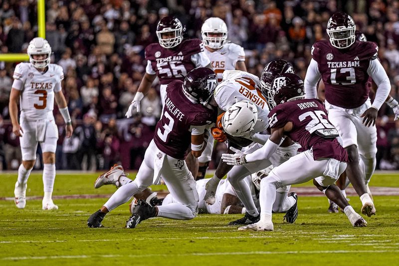 Texas Longhorns running back Quintrevion Wisner (26) runs the ball during the Lone Star Showdown against the Texas A&M Aggies at Kyle Field on Saturday, Nov. 30, 2024 in College Station, Texas.