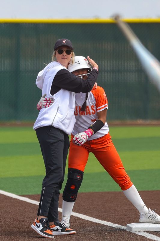 Dumas’ softball team headcoach, Carolyn Tolleson, hugs Dumas’ Yaritza Vargas against Brownwood at the Region I-4A Division I semifinal softball game, Friday, May 9, 2025, at First United Park.