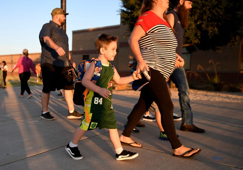Four-year-old Kenston Ferris walks to school with his family, Wednesday, Aug. 16, 2023, at Frenship Upland Heights Elementary. Ferris was starting pre-K.