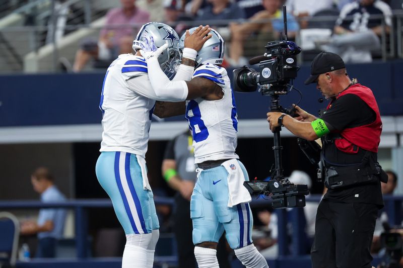 Oct 1, 2023; Arlington, Texas, USA; Dallas Cowboys quarterback Dak Prescott (4) celebrates with Dallas Cowboys wide receiver CeeDee Lamb (88) after throwing a touchdown pass during the first quarter against the New England Patriots at AT&T Stadium. Mandatory Credit: Kevin Jairaj-USA TODAY Sports
